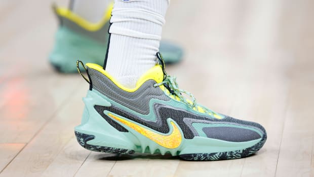 View of green and yellow Nike shoes.